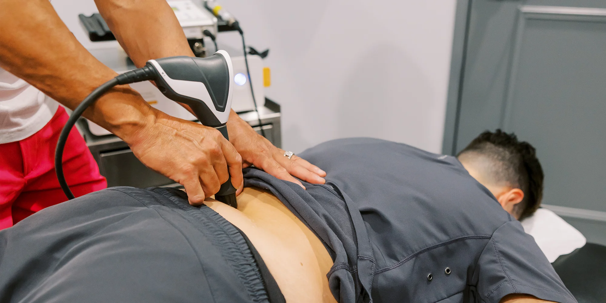 Pain Management Chandler AZ Patient Receiving Shockwave Therapy On Back Pain Management Chandler AZ Patient Receiving Shockwave Therapy On Back