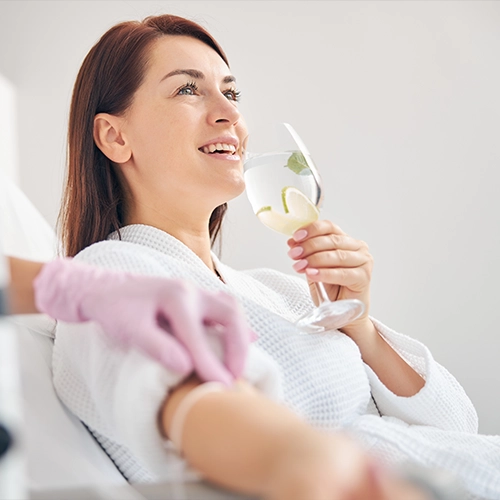 Pain Management Chandler AZ Smiling Woman Getting IV Therapy